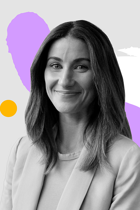 Clare Purvis surrounded by colorful graphic designs