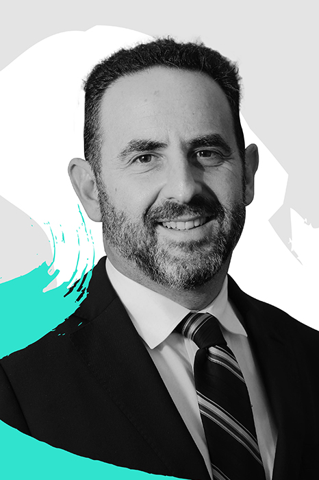 Dr. David Rock, co-founder and CEO of the NeuroLeadership Institute, surrounded by colorful graphic designs